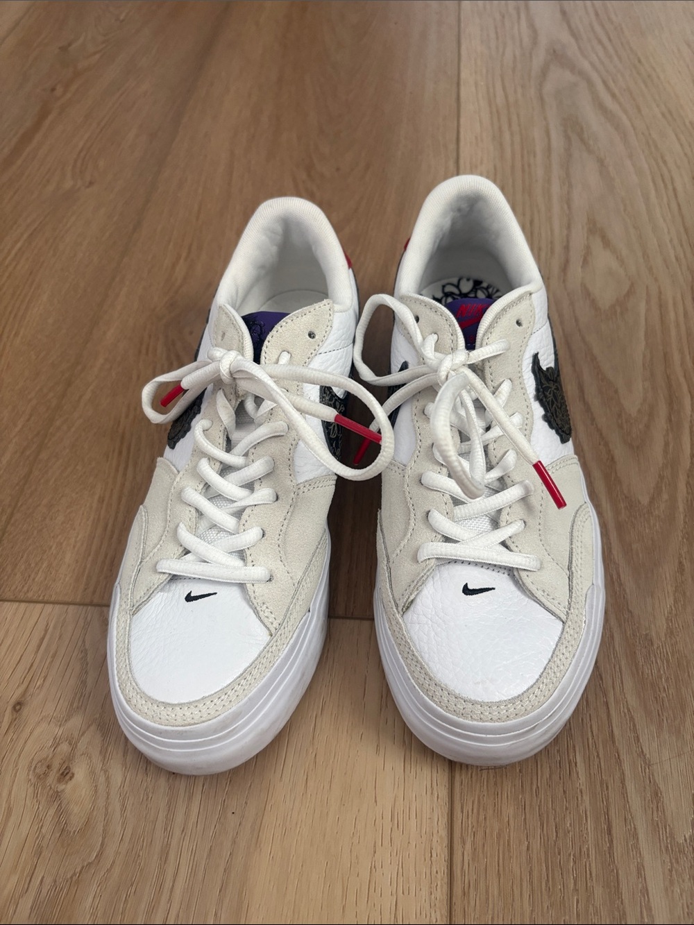 Nike Women’s White and Black Low-Top Sneakers with Red Accent